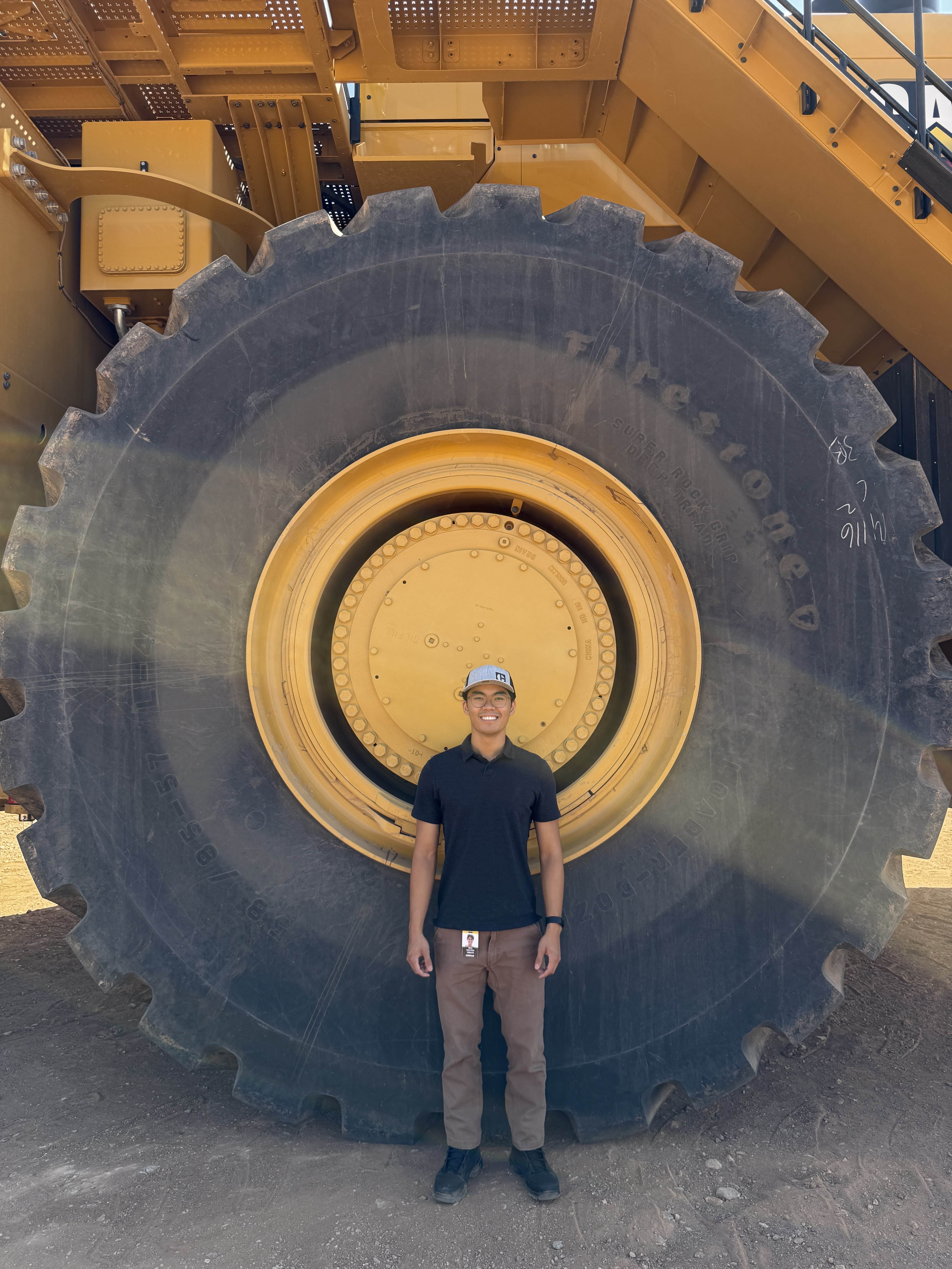 Posing with the big CAT wheel!